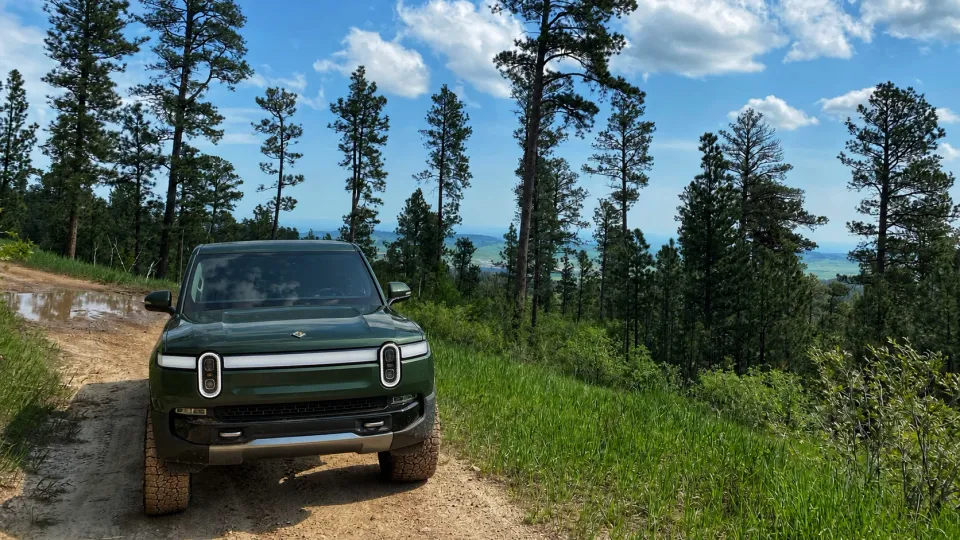 A green Rivian on Spearfish Mountain in South Dakota