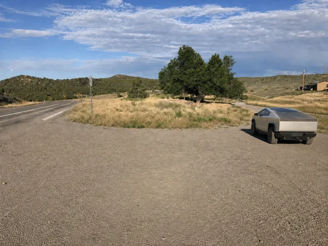 the paved approach and the start of County Road 14 on Yampa Bench Road in Dinosaur National Monument.