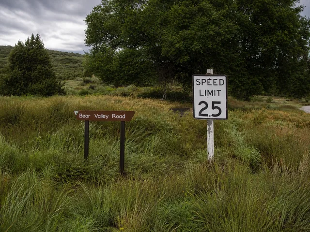 the roadside speed and route signs on Yampa Bench Road in Dinosaur National Monument.