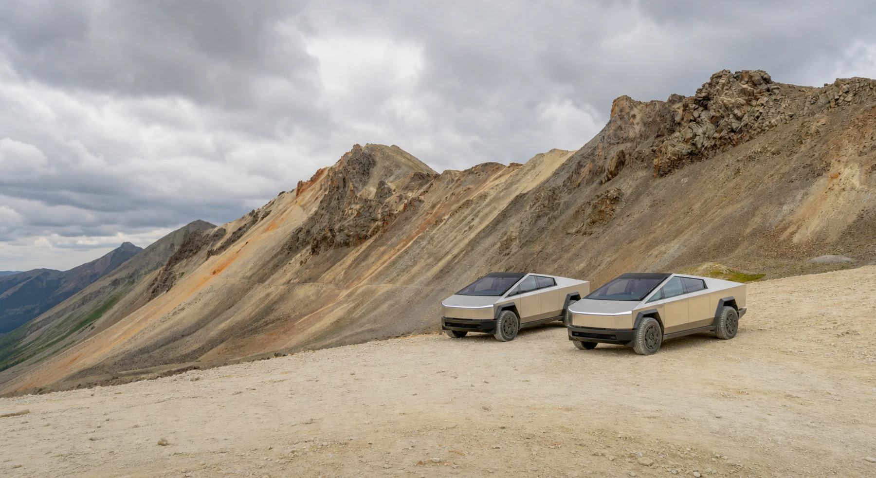 Two electric trucks on the alpine road to Engineer Pass