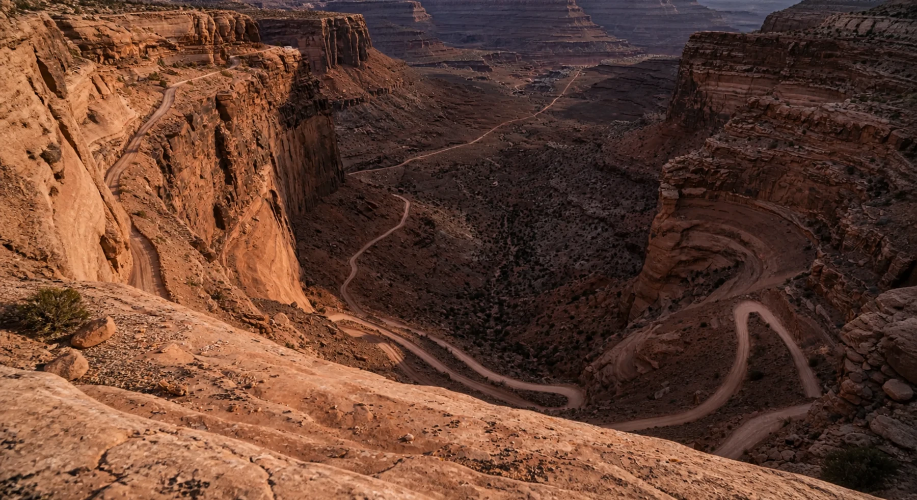 An electric truck on the Shafer Trail switchbacks near Moab