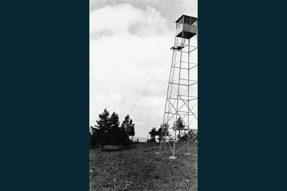 Black-and-white 1942 photograph of the tall steel fire tower on Desolation Butte.