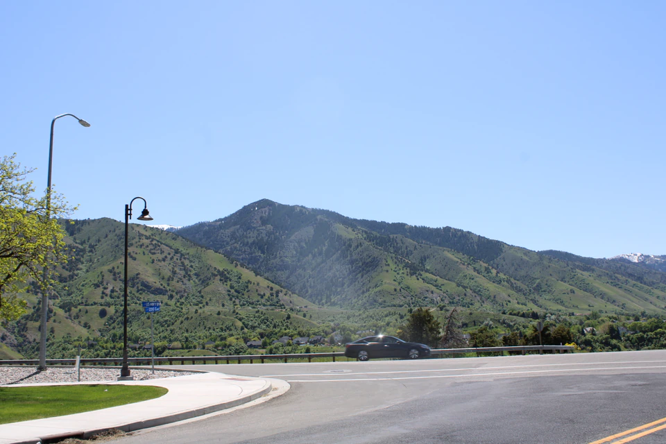 Logan Peak rising beyond Cache Valley beneath a blue sky.